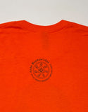 Back of t-shirt showing the Ambe Maamowisdaa logo.