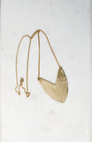 Brass Tulip Necklace on display