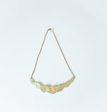 Brass Wave Necklace on display