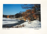 Photo Card of pond and trail covered in snow. Some trees in the background.