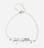 Stainless steel bracelet with "Tell the Full Story" in custom handwriting
