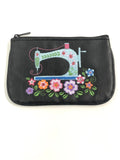 Black coin purse with embroidered sewing machine