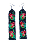Close product shot of beaded earrings, each with 3 red and pink rosebuds on a black background.