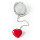 Mesh tea ball with red heart ornament