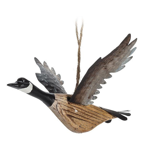Decorative flying goose ornament on a white background