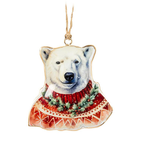 Polar bear ornament wearing a red sweater with Christmas decorations on a white background
