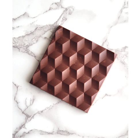 Chocolate square on marble background.