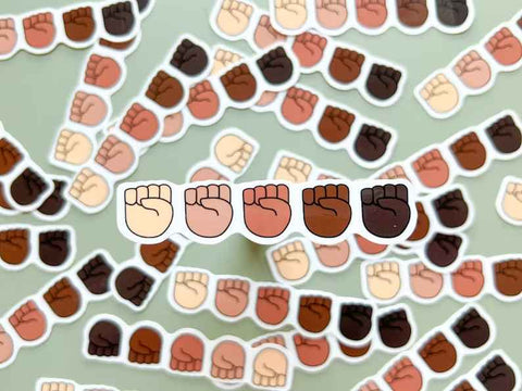 Sticker of five fists representing different races and solidarity. 