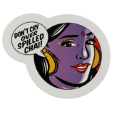 Round sticker with a stylized face and 'Don't cry over spilled chai!' text on a white background