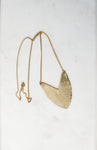 Brass Tulip Necklace on display 