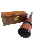 Spyglass beside wooden box