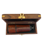Wooden box with a lid open, revealing spyglass inside.
