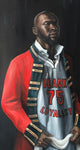 Black man in military jacket and basketball jersey holding a towel.