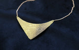 Brass Shield Necklace on display 