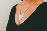 Brass Tulip Shield Necklace on model 