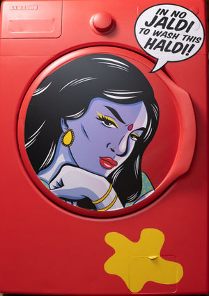 Washing machine covered in red vinyl with pop art stickers.