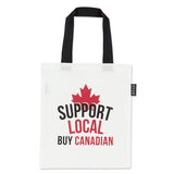 White tote bag with black handles featuring a red maple leaf and text 'Support Local Buy Canadian' on a white background.
