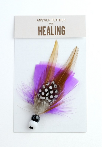 Close product shot of purple answer feather for healing