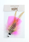 Bright pink answer feather for hope