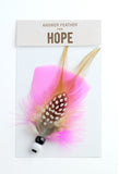 Bright pink answer feather for hope