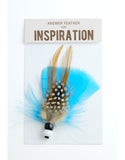 Close product shot of turquoise blue answer feather for inspiration