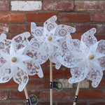 Close product shot of three lace style windmills