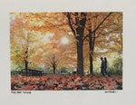Photo Card of yellow and orange Autumn leaves. Two people are walking in the background. 
