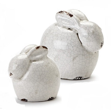 Group shot of small and medium white crackle sitting rabbit