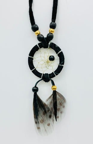 Close product shot of dream catcher necklace in black
