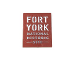 A red square magnet. Fort York National Historic Site in white letters. 