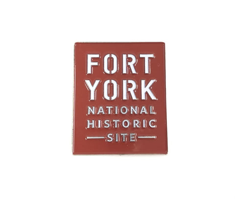 A red square magnet. Fort York National Historic Site in white letters. 