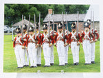 Postcard of soldiers in redcoat uniforms and holding muskets