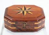 Close product shot of hardwood box with compass star inlay