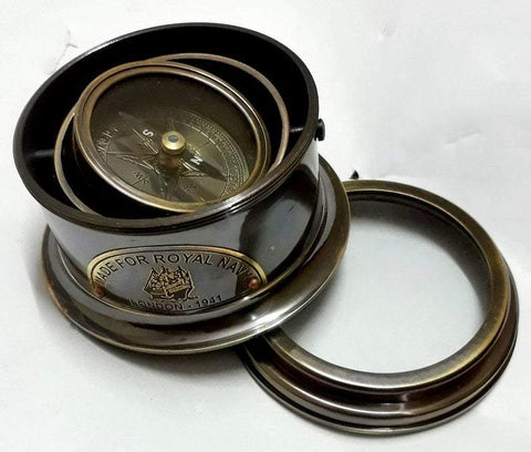 Close product shot of open naval brass gimbal compass in antique finish