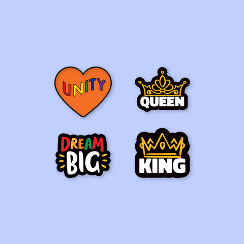 Group shot of the Unity, Queen, Dream Big and King Enamel Pins