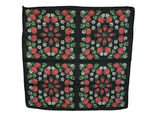 Black background with strawberries, white flowers and green leaves.