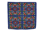 Blue background with strawberries, white flowers and green leaves.