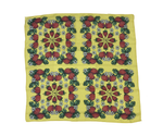 Yellow background with strawberries, white flowers and green leaves.