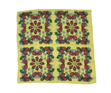 Yellow background with strawberries, white flowers and green leaves.