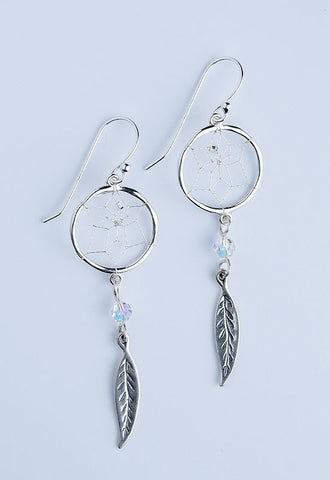 Close product shot of sterling silver dream catcher earrings with Swarovski crystal and sterling silver feather