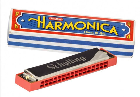 Close product shot of harmonica with box