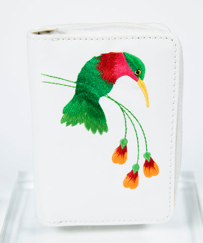 White card holder with embroidered hummingbird and flowers.
