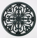 A round rubber stepping stone with wrought iron styling