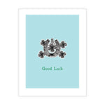 Eco-friendly greeting card with horse shoe and clover illustration and the words "Good Luck"