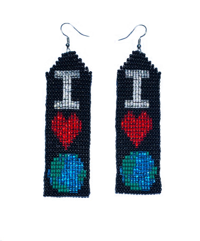 Close product shot of beaded earrings, showing the letter I, a red heart, and stylized earth on a black background