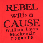 Close up of text "Rebel with a Cause William Lyon Mackenzie Toronto" printed in black on a red t-shirt