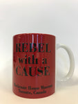 "Rebel with a Cause Mackenzie House Museum, Toronto, Canada" printed on red mug with white handle