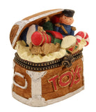 Hinged box in the shape of a  toy box filled with holiday items.