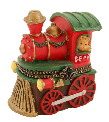 Hinged box in the shape of a red train steam engine with a bear in the window.