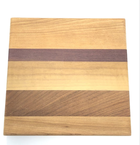 A Cheese Board with stripes of different wood.